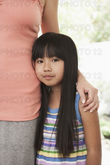 Mother and daughter hugging