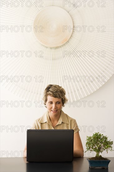 Businesswoman working at desk in office