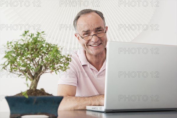 Businessman working at desk in office