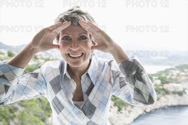 Woman peering through window