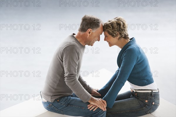 Couple sitting together outdoors