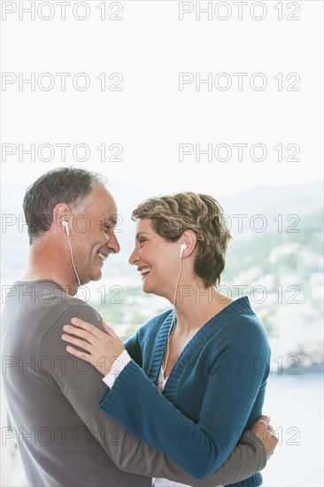 Couple listening to earphones together