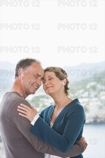 Couple listening to earphones together