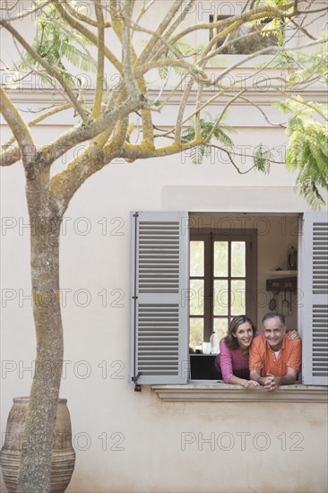 Couple looking out window