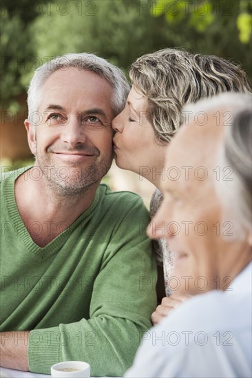 Couple kissing outdoors