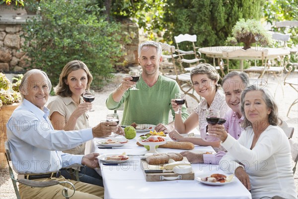 Friends eating together outdoors