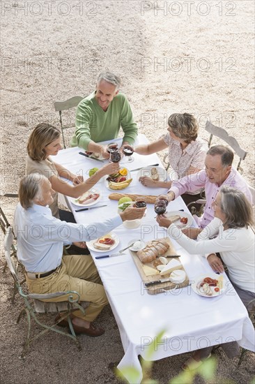 Friends eating together outdoors