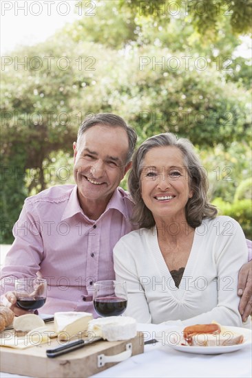 Couple eating together outdoors