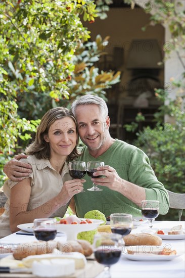 Couple eating together outdoors