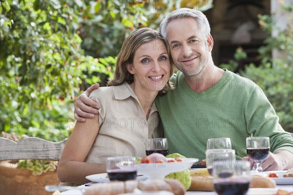 Couple eating together outdoors