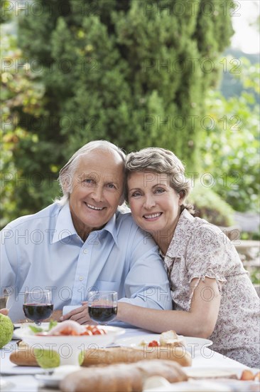 Couple eating together outdoors