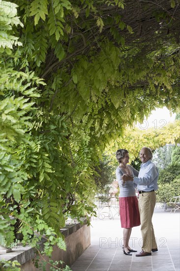 Couple dancing together outdoors