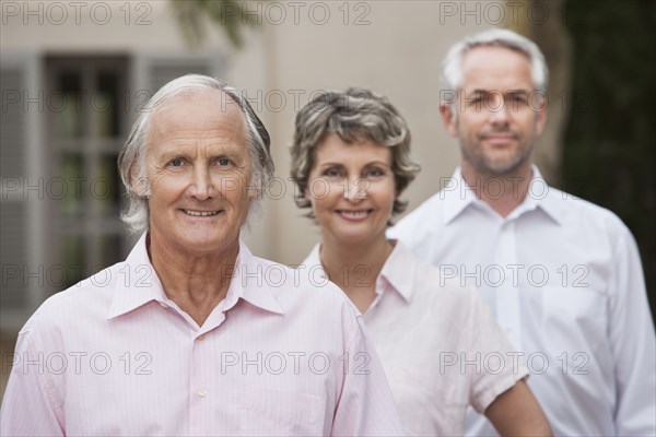 Friends smiling together outdoors