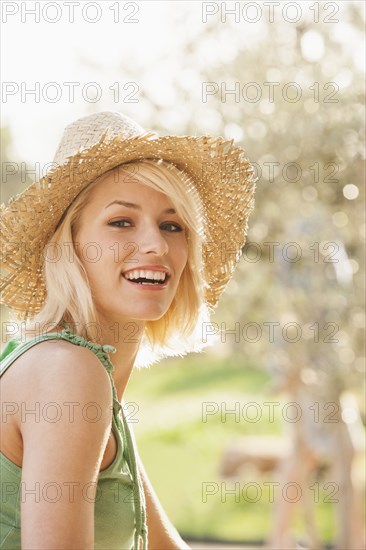 Woman wearing straw hat outdoors