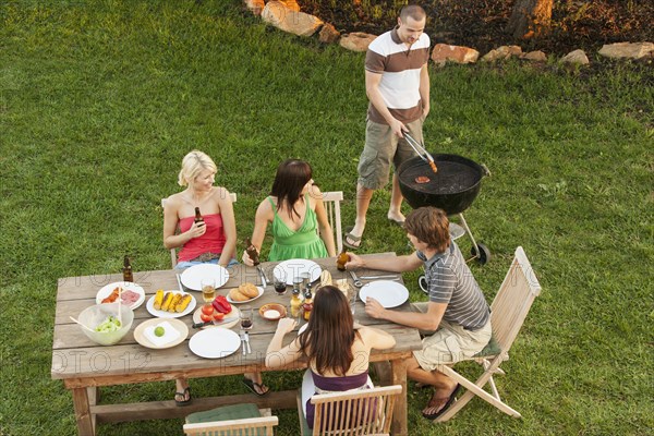 Friends eating together outdoors