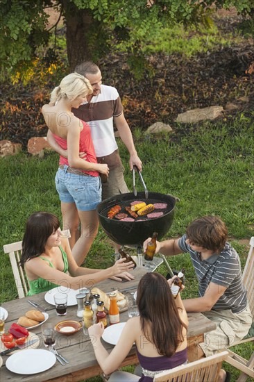 Friends eating together outdoors