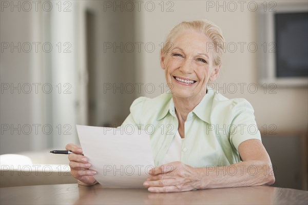 Senior Caucasian woman reading letter