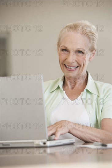 Senior Caucasian woman using laptop