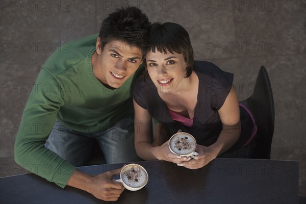 Caucasian couple drinking coffee together