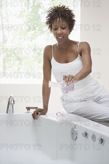 African American woman pouring bath