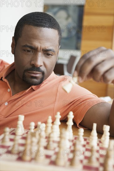 African American man playing chess