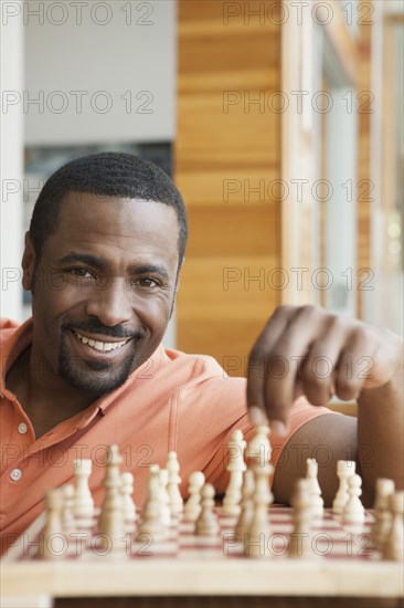 African American man playing chess