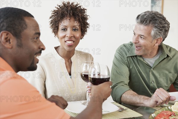 Friends having wine together at dinner