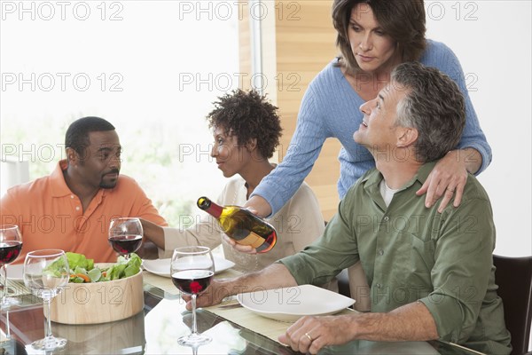 Friends having wine together at dinner