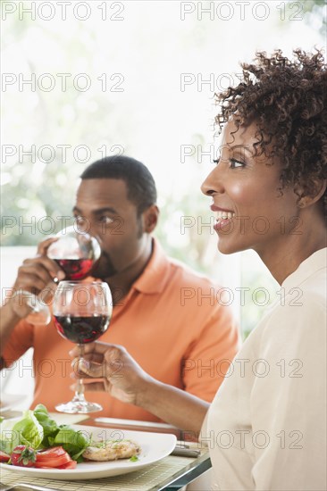 African American couple eating together