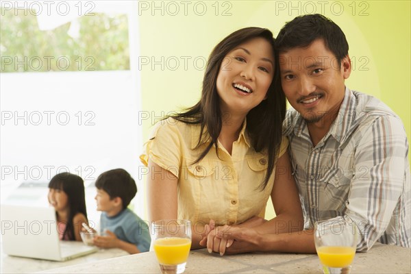 Couple hugging at breakfast table