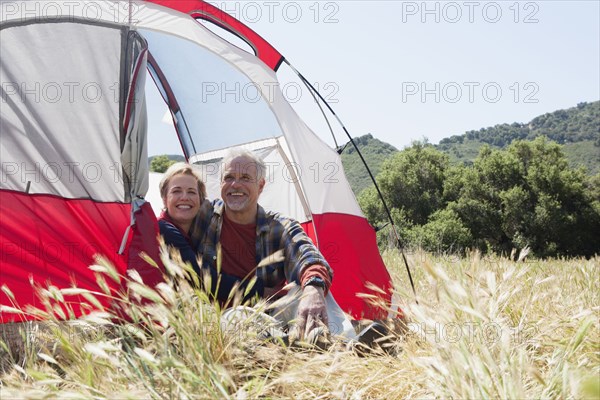 Senior Caucasian couple relaxing at campsite