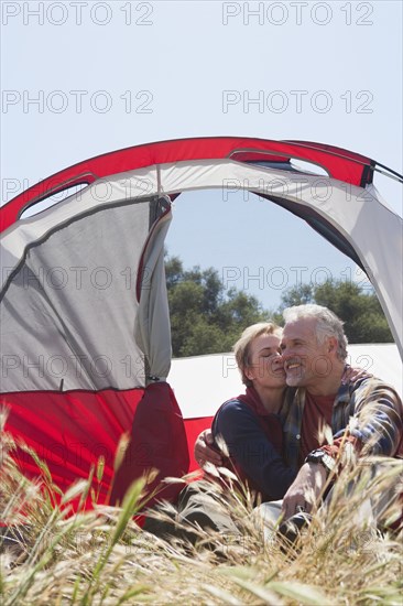 Senior Caucasian couple relaxing at campsite