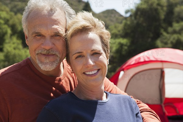 Senior Caucasian couple smiling outdoors