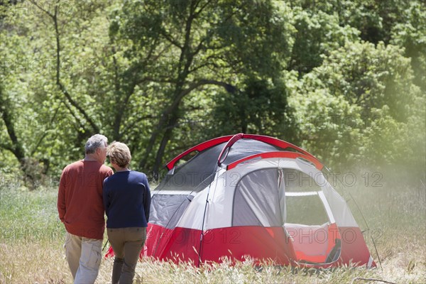 Senior Caucasian couple admiring campsite