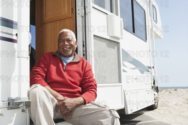 Mixed race Senior man smiling in RV