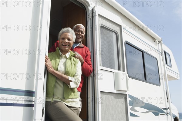 Mixed race Senior couple smiling in RV