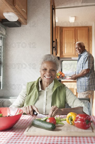 Mixed race Senior couple cooking in RV