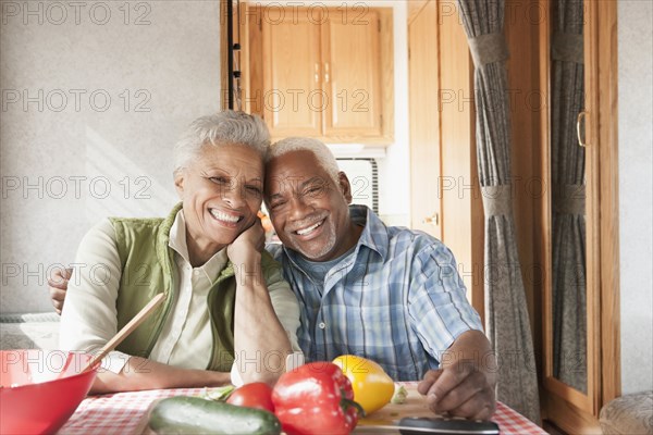 Mixed race Senior couple smiling in RV