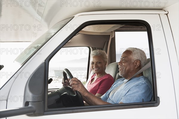 Mixed race Senior couple driving RV