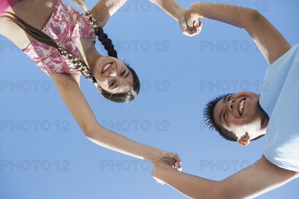 Hispanic children playing outdoors