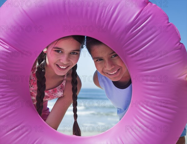 Hispanic children playing on beach