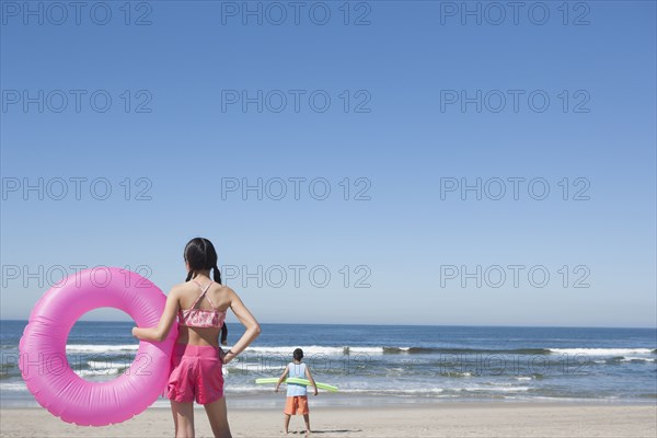 Hispanic children playing on beach