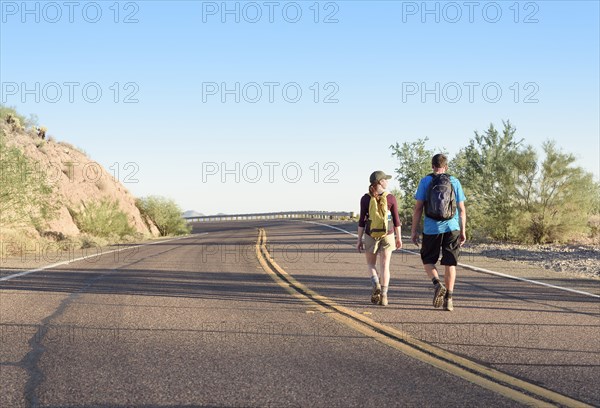 Couple hiking on winding street