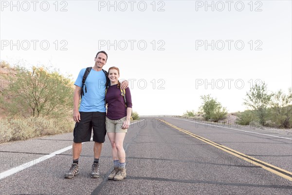 Portrait of hikers posing in street