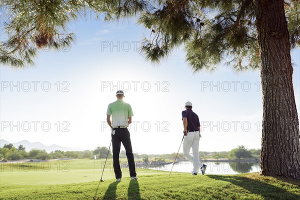 Friends standing on golf course