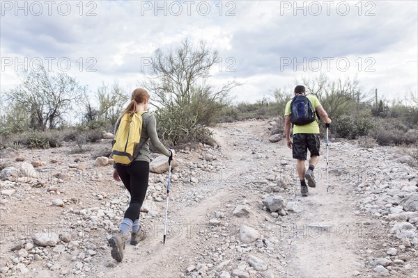 Couple hiking on rocky path