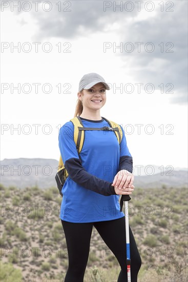 Portrait of smiling Caucasian woman hiking in desert