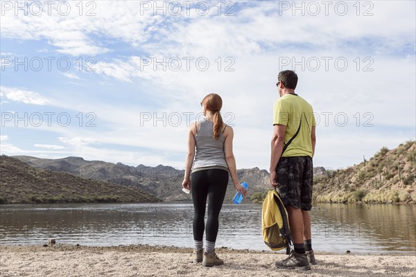 Hikers resting at lake