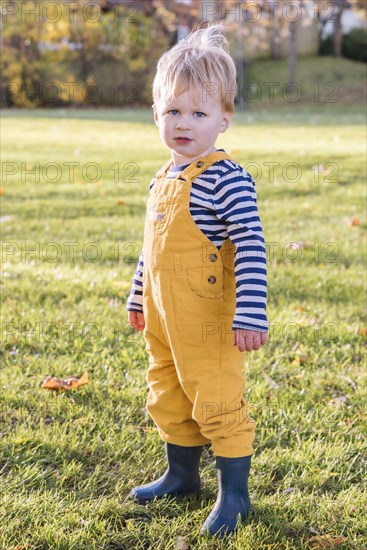 Portrait of Caucasian boy standing in field