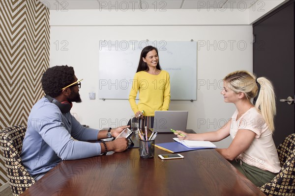 Creative business people meeting near whiteboard